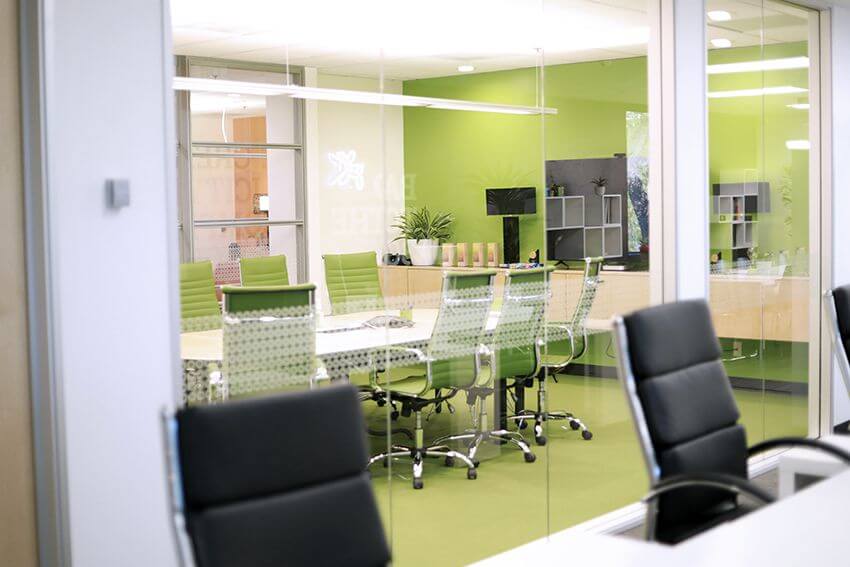 green conference room wall of glass panels